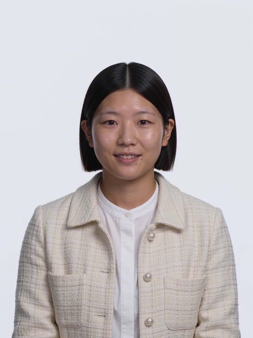 Centered studio portrait of a woman with a short dark bob wearing a cream textured jacket