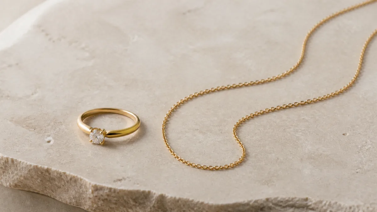 Gold jewelry arranged in a controlled product photography setup